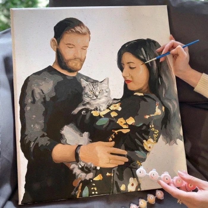 Custom paint by numbers kit featuring a couple holding a grey cat, DIY personalized portrait from photo.