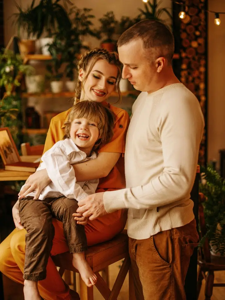 A happy family of three portrait used to demonstrate a custom paint by numbers conversion.