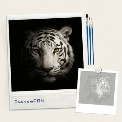 CustomPBN white tiger paint by numbers kit including the numbered canvas, reference photo, and three paint brushes.