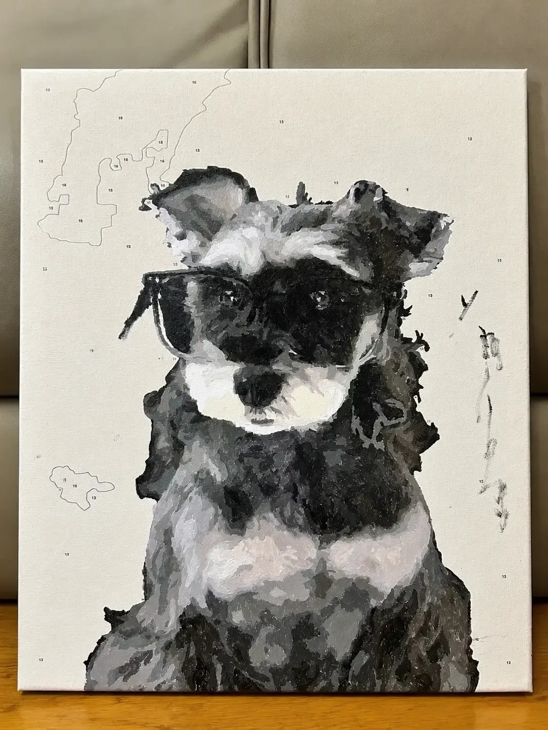 Custom pet paint by numbers canvas featuring a schnauzer dog wearing sunglasses, shown during the painting process.