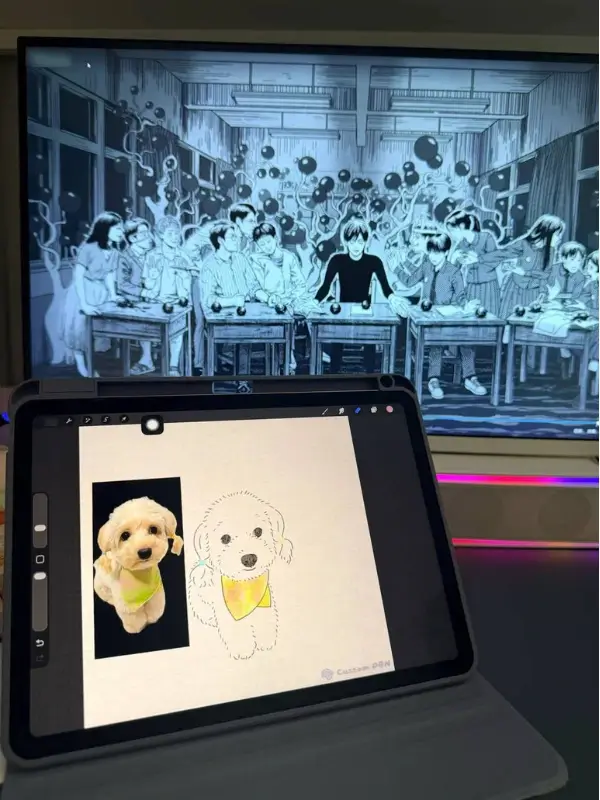 A CustomPBN artist drawing a fluffy brown poodle portrait by hand on a tablet beside the pet reference photo.