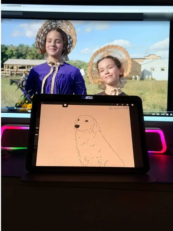 A hand-drawn golden retriever pet portrait in progress on a tablet at the CustomPBN artist workspace.