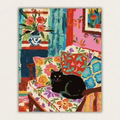 Black cat sitting on a colourful floral patterned armchair paint by numbers finished canvas
